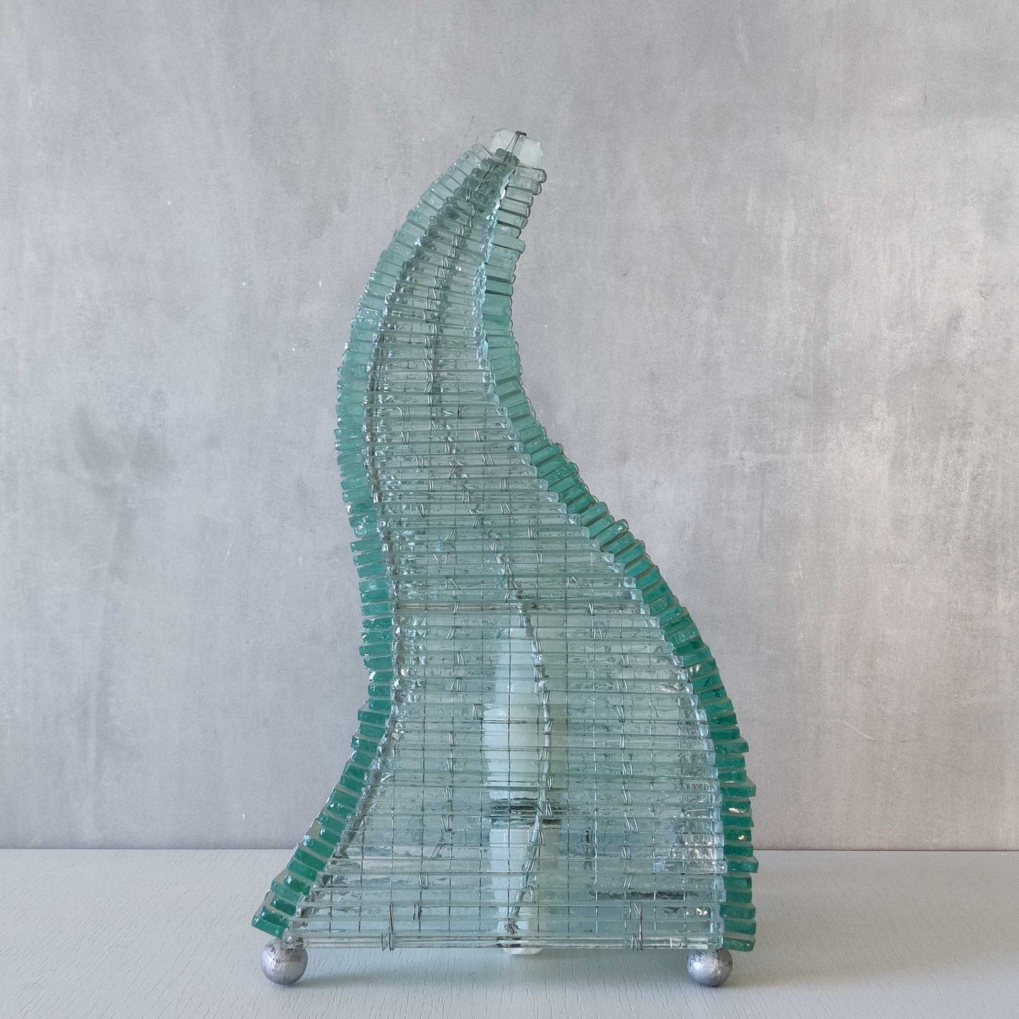 A 1970s stacked glass shard sculptural twisted pyramid lamp