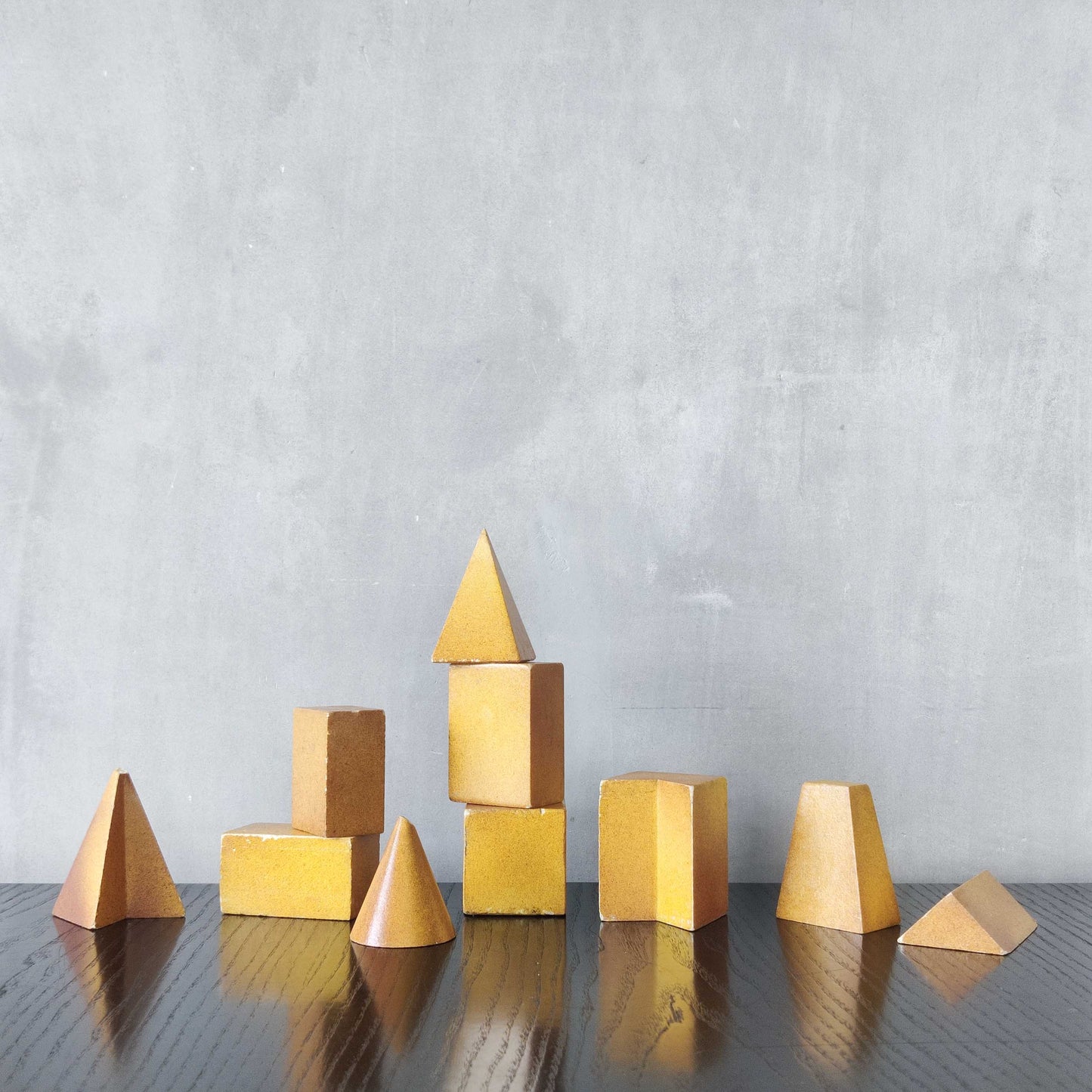 A set of 10 painted cast plaster 1950s geometric solids architectural models