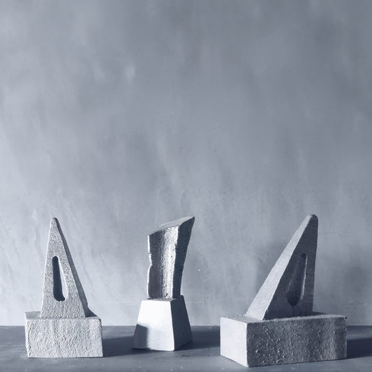 Trio of cast aluminium sculptures