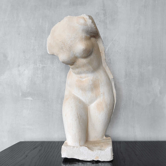 A large vintage studio plaster cast sculpture study of a female torso