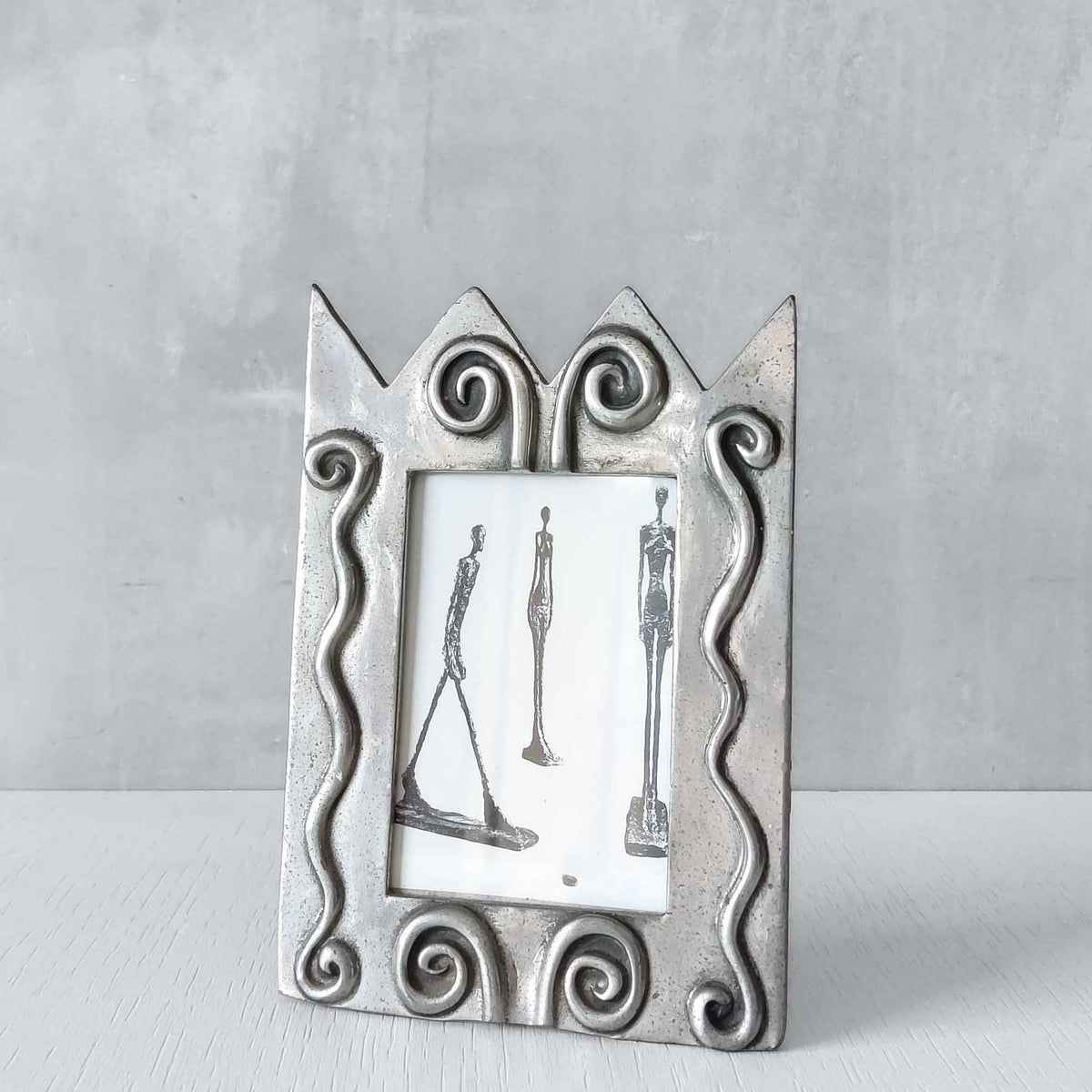 An early 1990s Carrol Boyes sculptural cast pewter photo frame with scroll reliefs