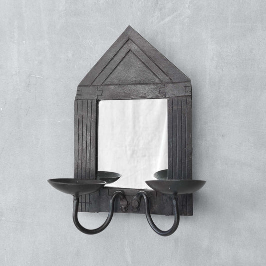 A small vintage architectural pedimented steel framed mirror candle sconce