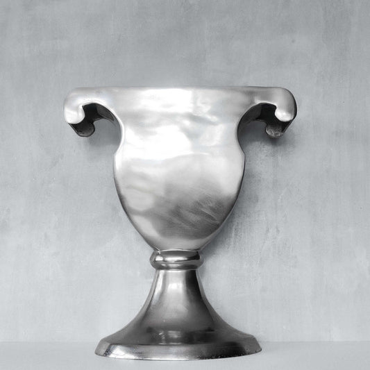 A vintage large cast aluminium sculptural urn profile vase