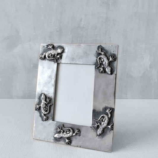 A vintage hand sand cast aluminium photo frame with gecko motifs